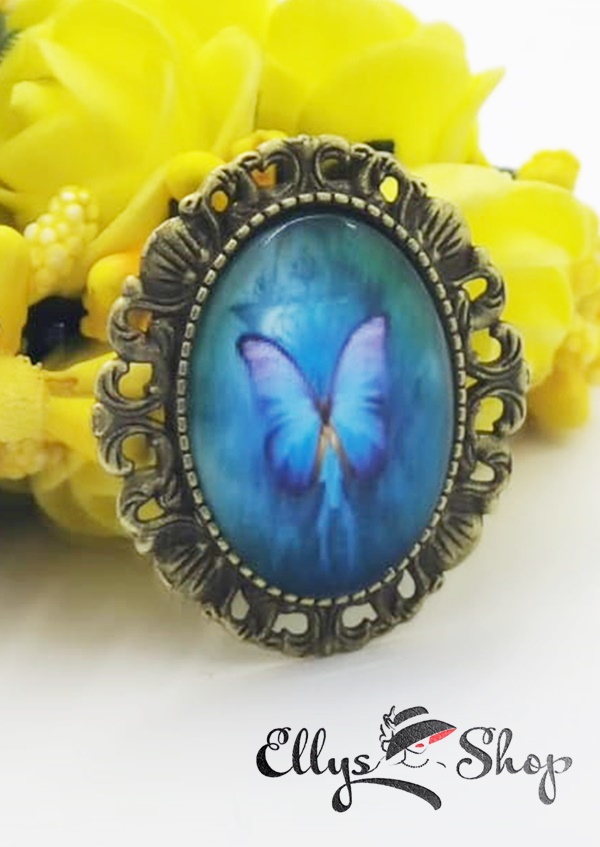 Brosa pandantiv handmade cu imagine fluture pe fond turcoaz cod 4703